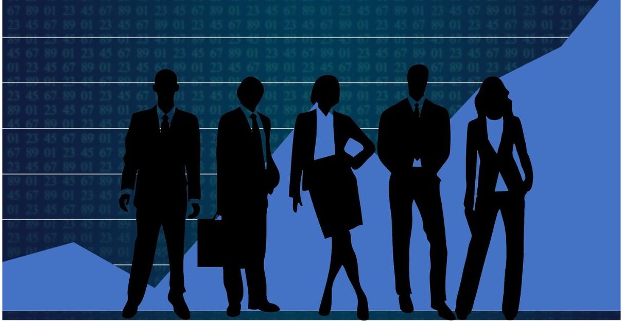 Dark blue line graph with the line going up linearly and 5 business people (2 female, 3 males) standing in front of it in a silhouette that's black and matching the background colors